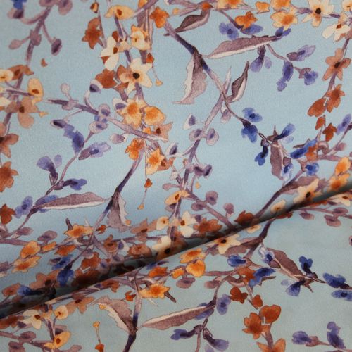 Blauwe polyester met takjes en bloemetjes