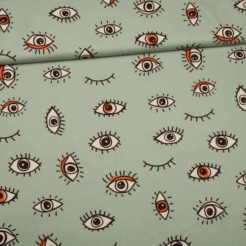 Groene polyester crêpe tricot met ogen - Knipmode Collectie Lente-Zomer 2022 - stoffen van leuven