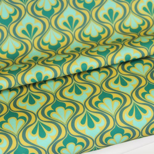 Polyester stretch met groen en blauw golvend patroon