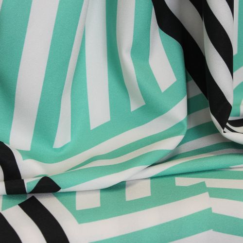 Polyester crêpe stretch wit met turquoise/zwart gestreept patroon - Burda