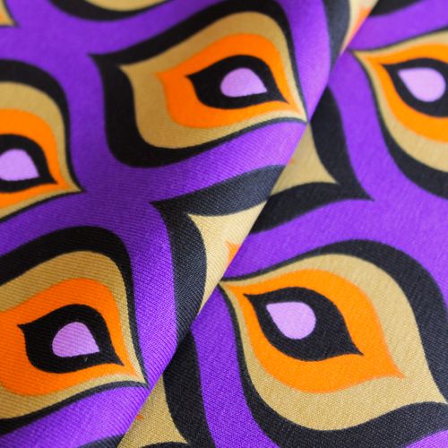 Katoen tricot paars met kleurrijk motief
