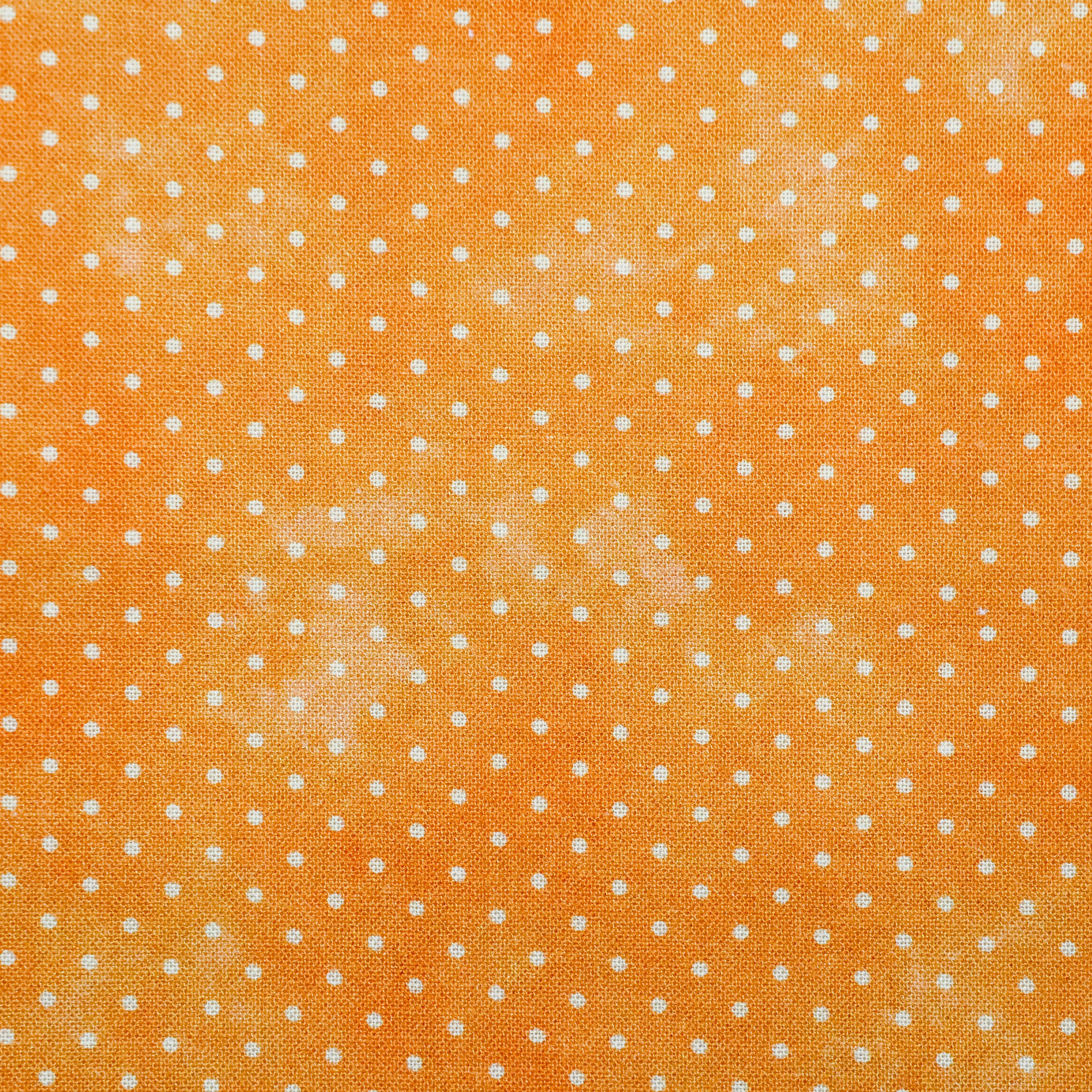Katoen oranje met witte stippen