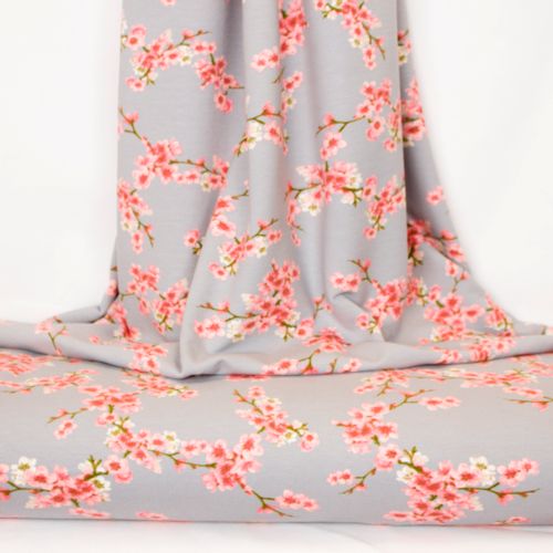 Grijze sweaterstof met roze bloemen van Poppy
