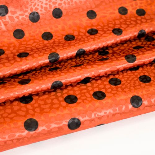 Oranje gesatineerde polyester jacquard stretch met zwarte stippen
