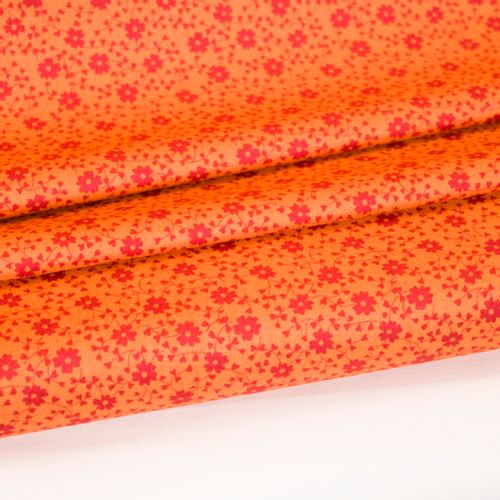 Oranje katoen met rood bloemenmotief