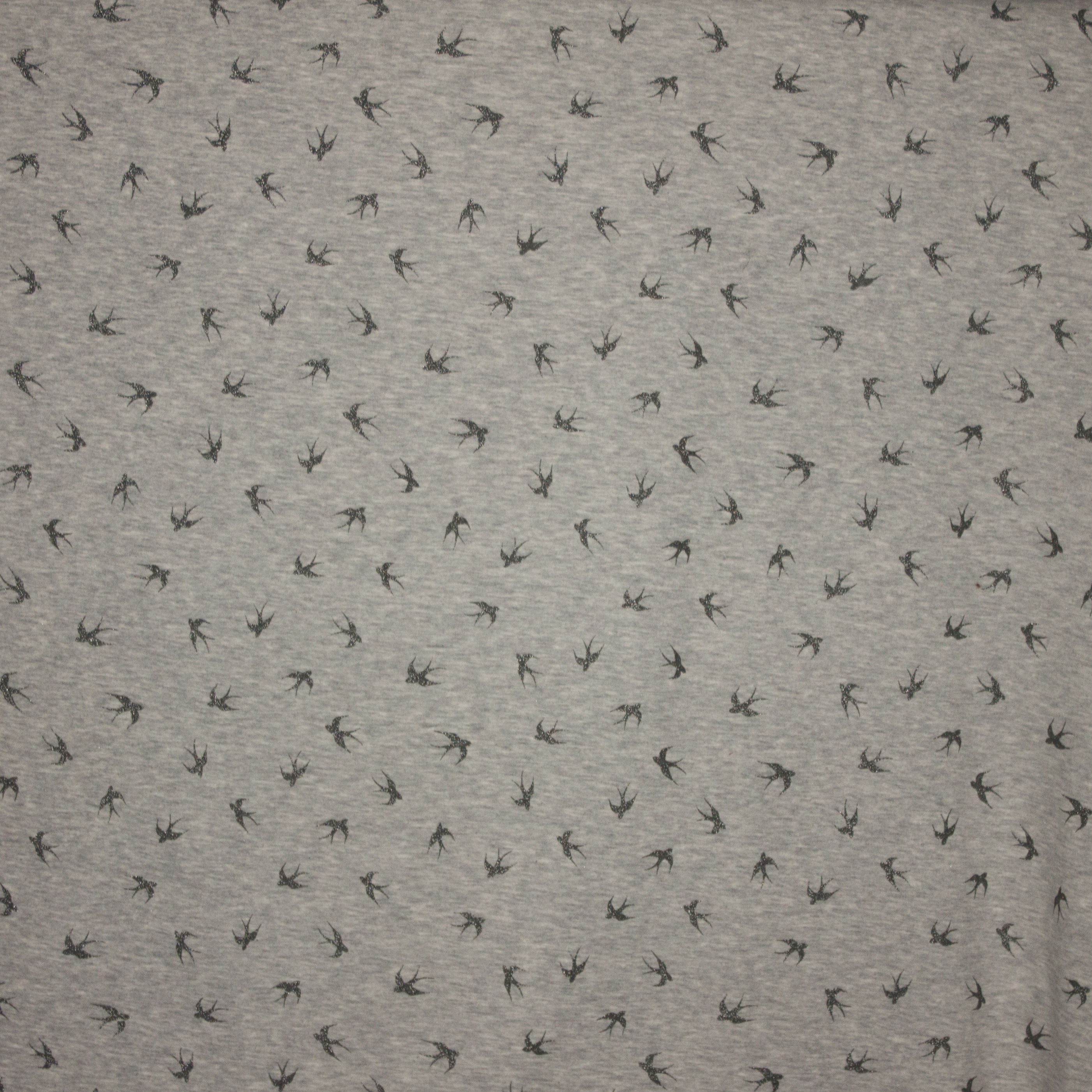 sweaterstof in lichtgrijs met zwaluwen