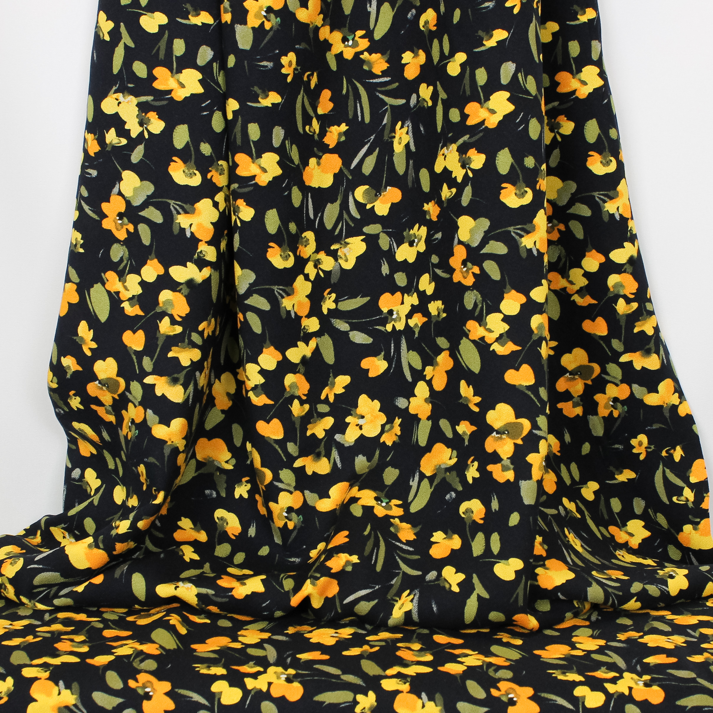 Zwarte viscose crêpe met gele bloemetjes