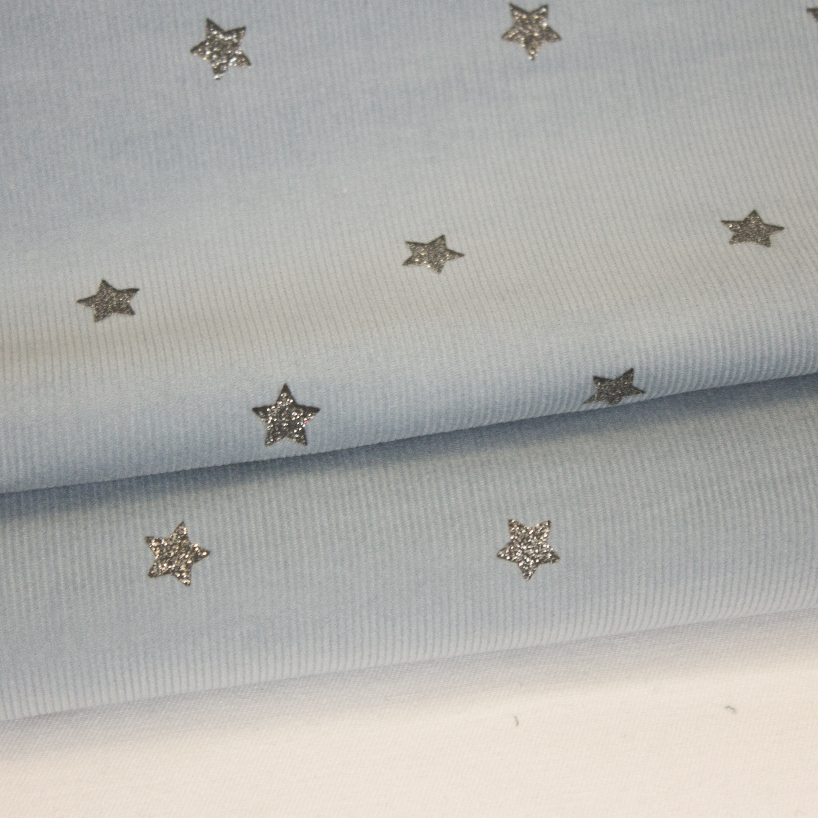 Blauwe ribfluweel met zilveren glitter sterretjes