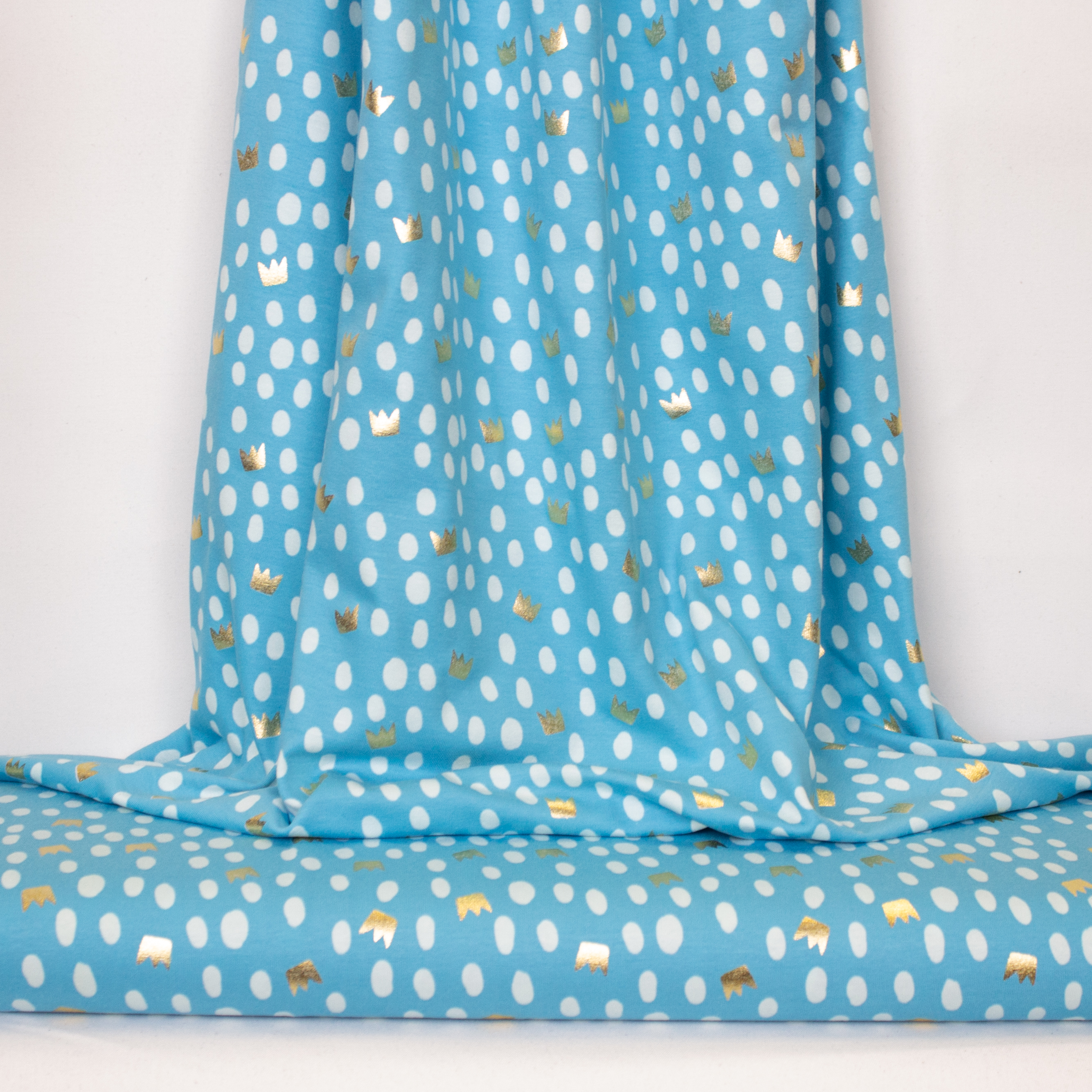 Blauwe tricot met gouden kroontjes en stippen