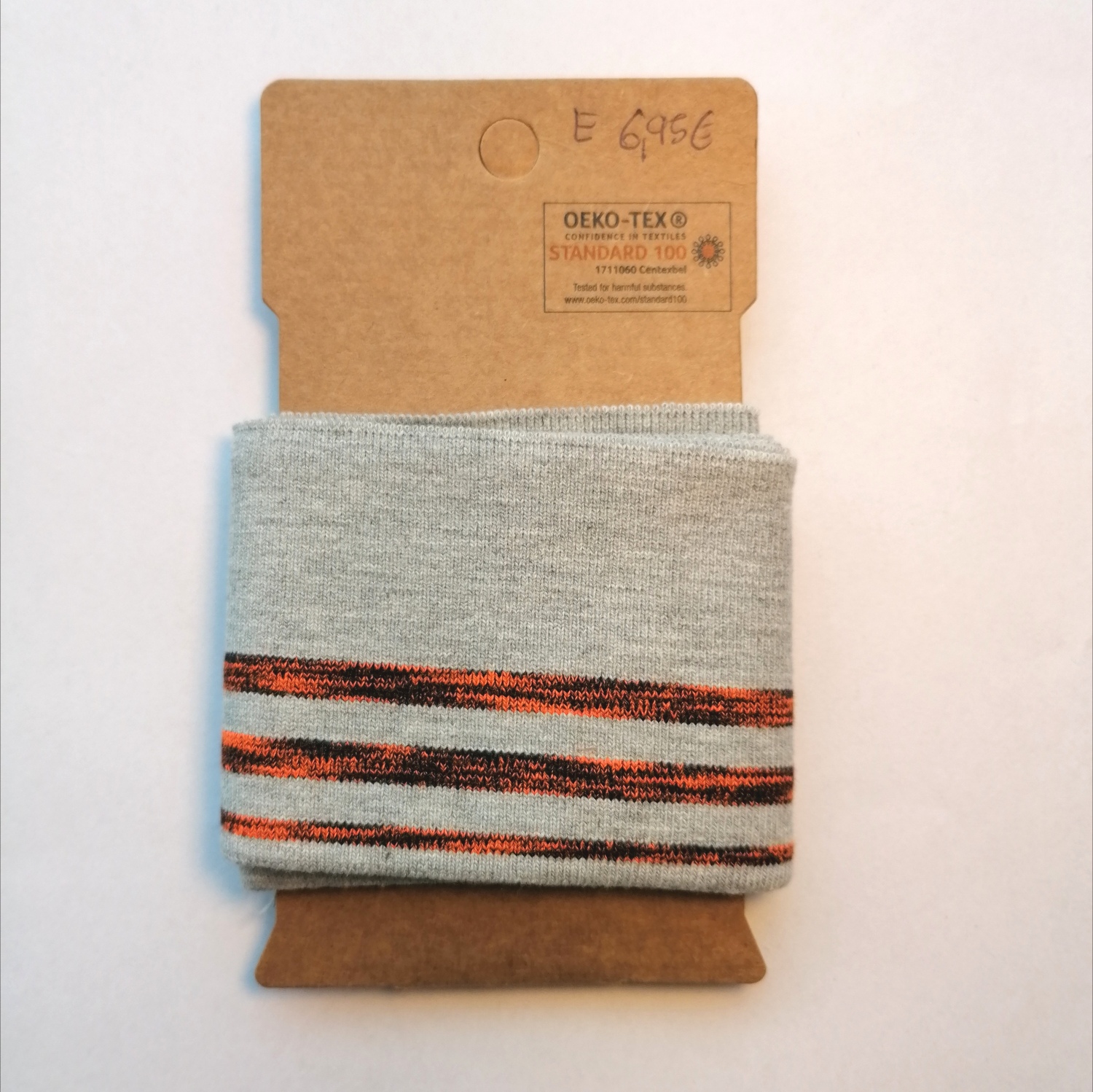 Grijze cuff (boordstof) met fluo oranje/zwarte strepen