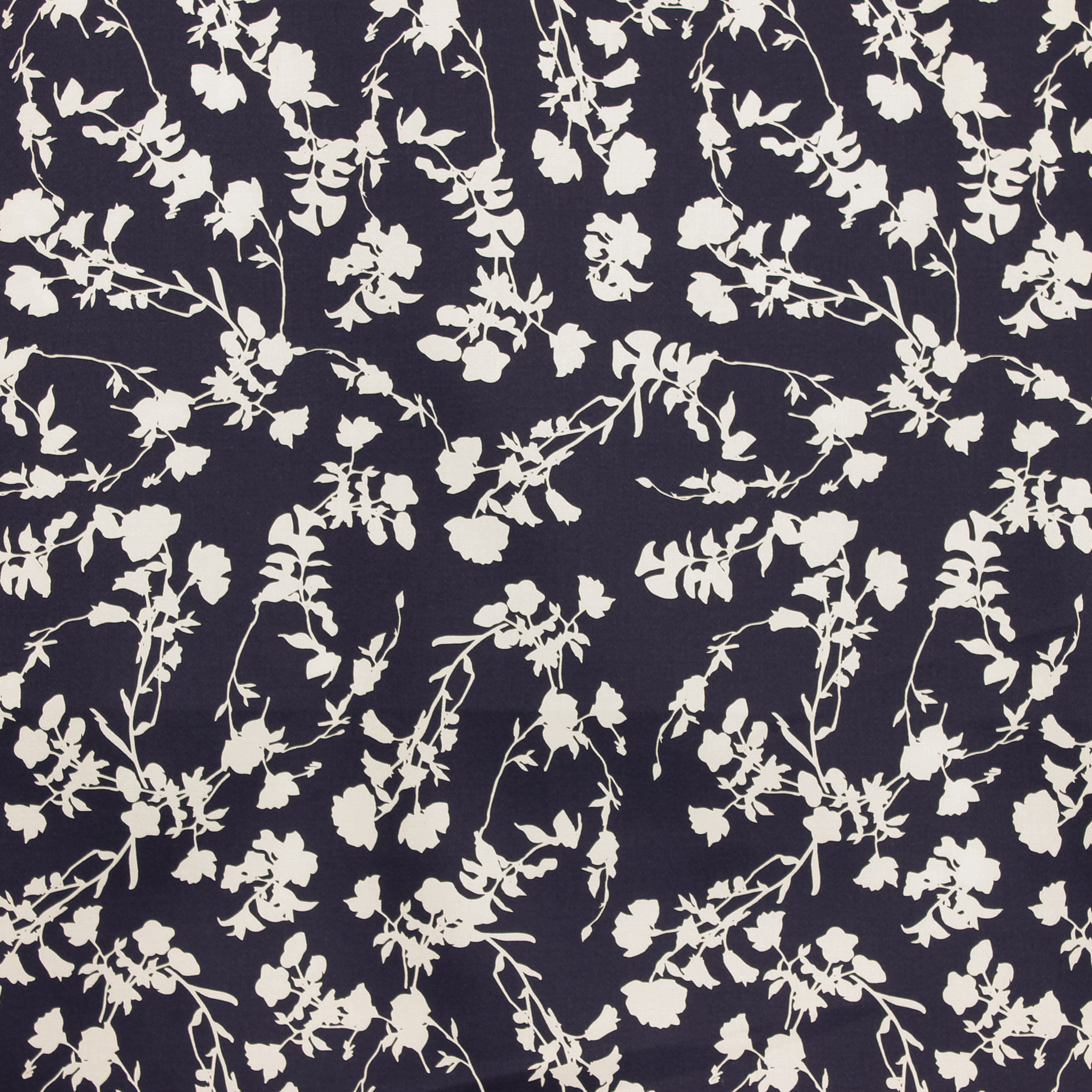 Blauwe stevige katoen stretch met witte silhouetten van bloemen