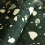 Stretch crêpe groen met vlekken
