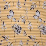 Gestreepte tricot in wit en okergeel met bloemen dessin van 'Stitched By You'