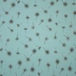 Munt sweaterstof met pluisbloemen motief met zilveren glitter