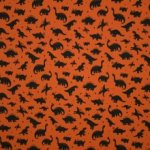 Roestkleurige tricot met zwarte dino's