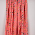 Zalmroze tricot met ijsjes- en sterrenmotief van Poppy