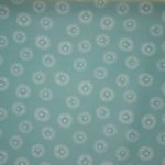 Turquoise katoentricot met leeuwenkoppen 'Little King'