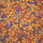 Bruine viscose met gele, oranje en blauwe bloemen