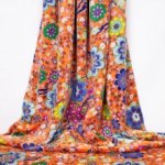 Oranje nicky velours met bloemen