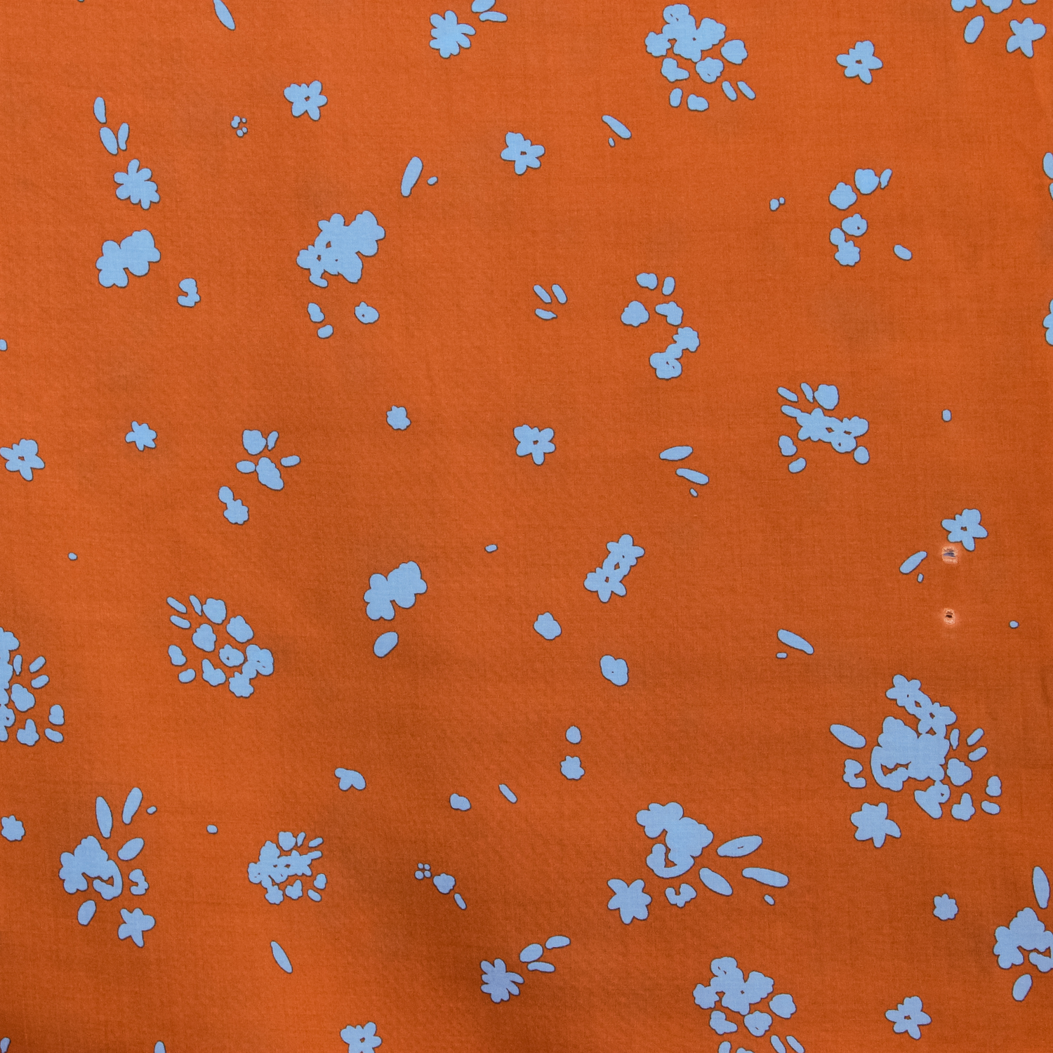 Viscose ecovero oranje met blauwe print - Fibre Mood