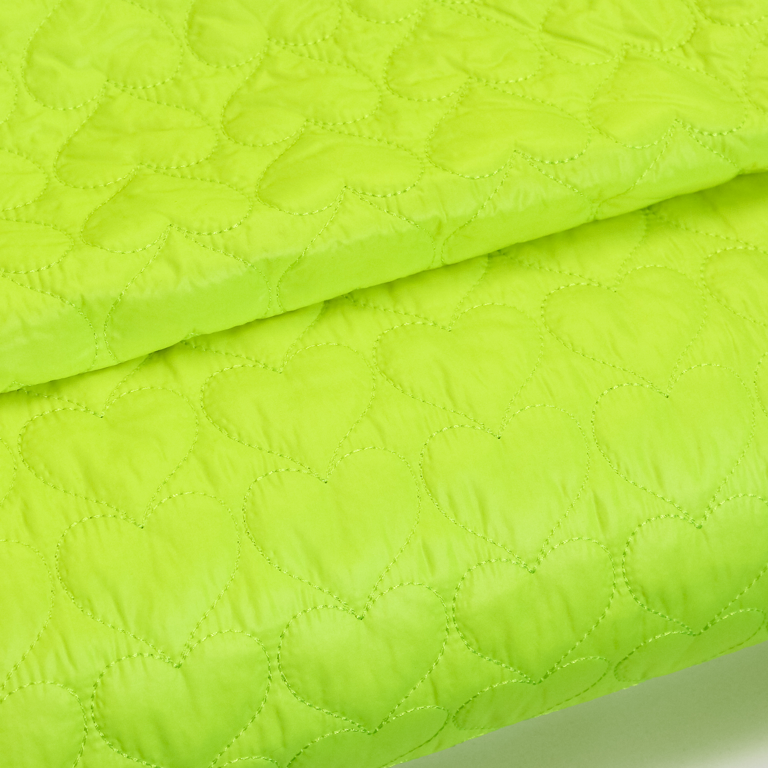 Fijne matelassé neon groen met hartjes
