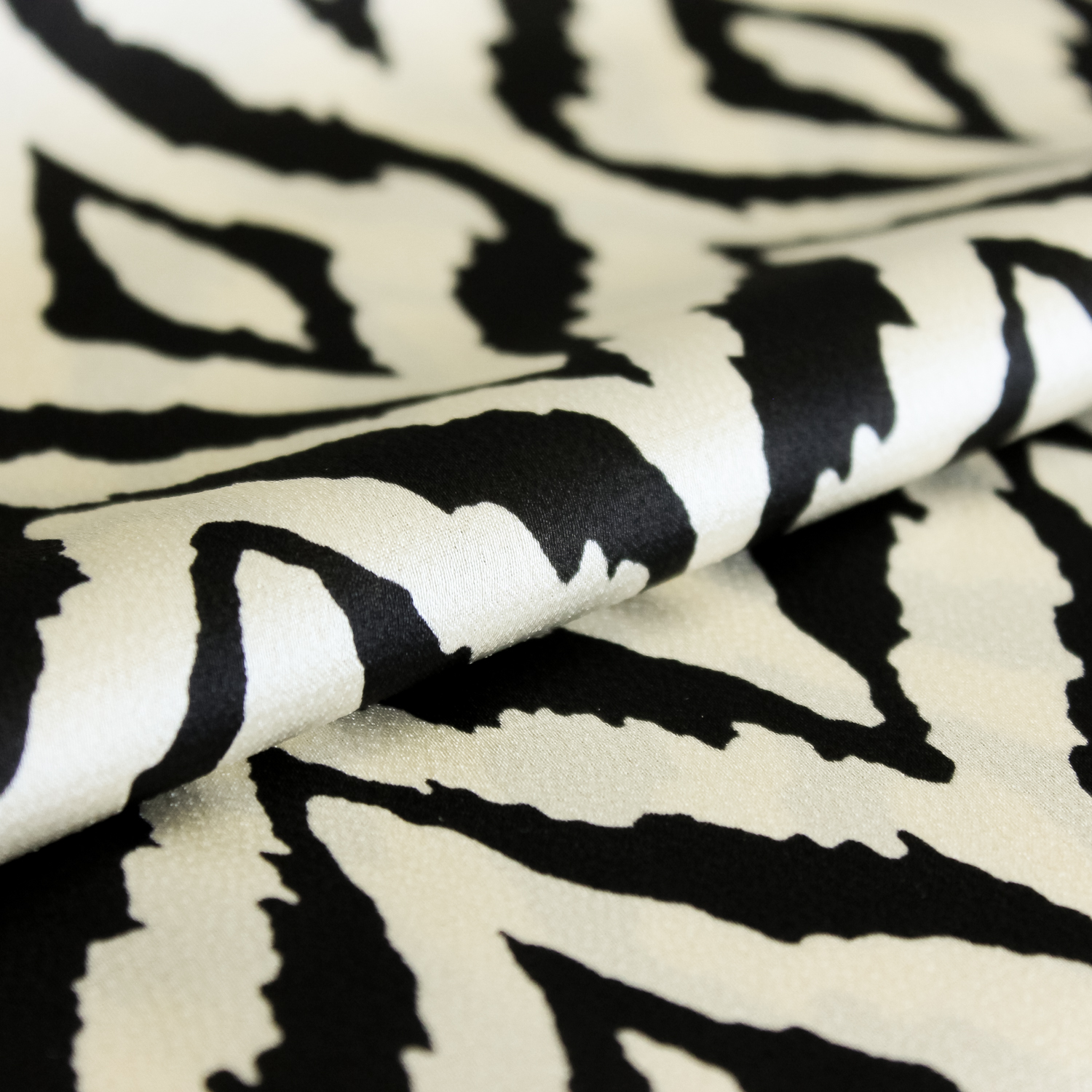 Polyester ecru met zwart patroon