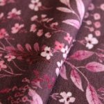 French Terry mauve met roze bloemen
