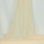 Tule ivoor met bolletjes