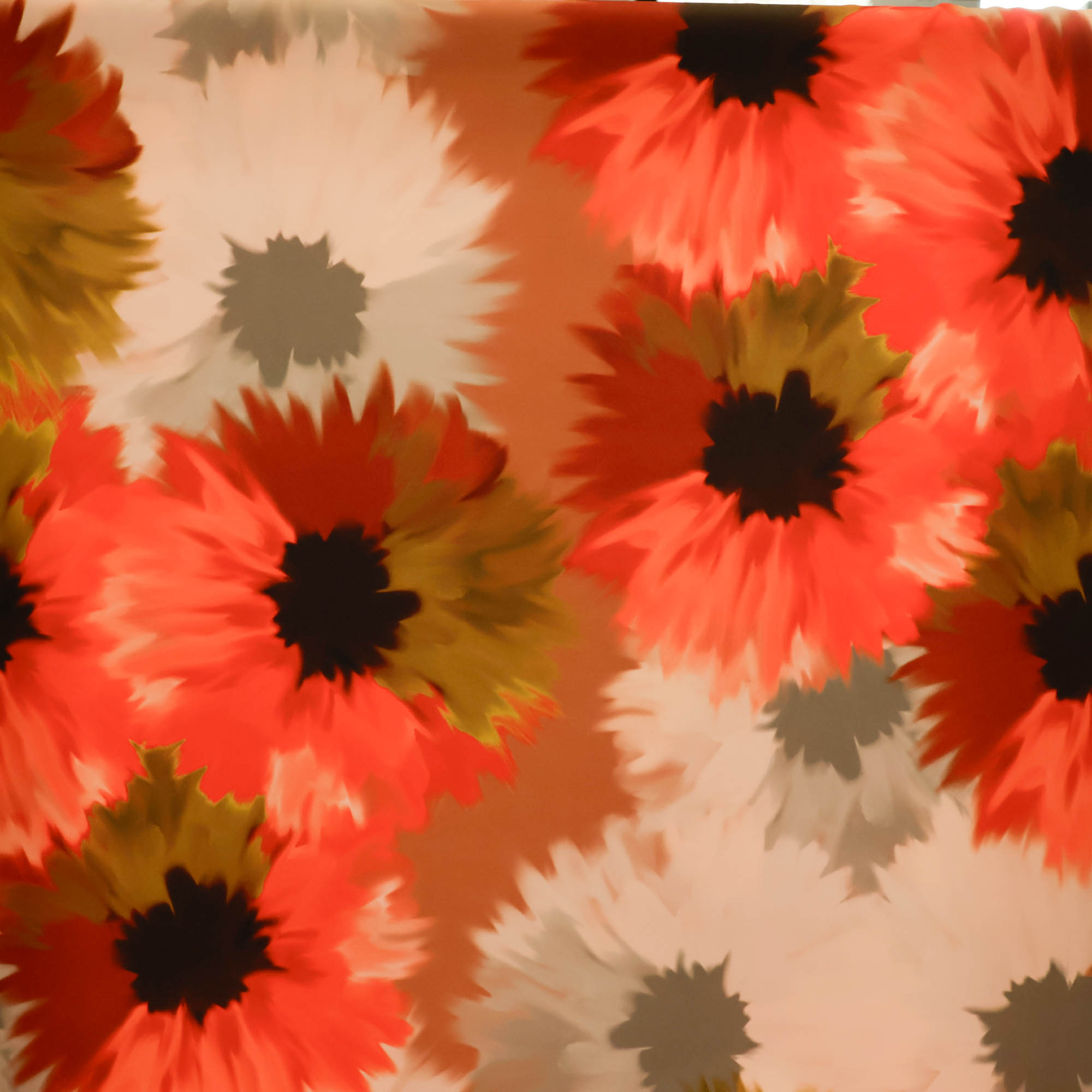 Polyester stretch oranje met bloemenprint