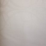 Jacquard polyester wit met sierlijke figuren