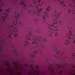Fantasievoering double face fuchsia met sierlijk bloemen motief
