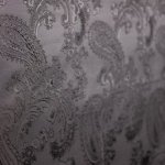 Fantasievoering zwart met paisley patroon