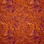 Viscose crêpe oranje met bladeren patroon