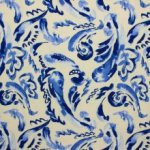 Polyester tricot beige met blauwe print