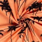 Badstof glanzend oranje met palmbomen