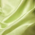 Satijn groen / geel met golvende lijn langs rand