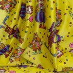Polyester geel met clownpatroon