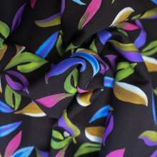 Stretch viscose zwart met bladeren