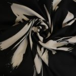 Polyester zwart met wit patroon