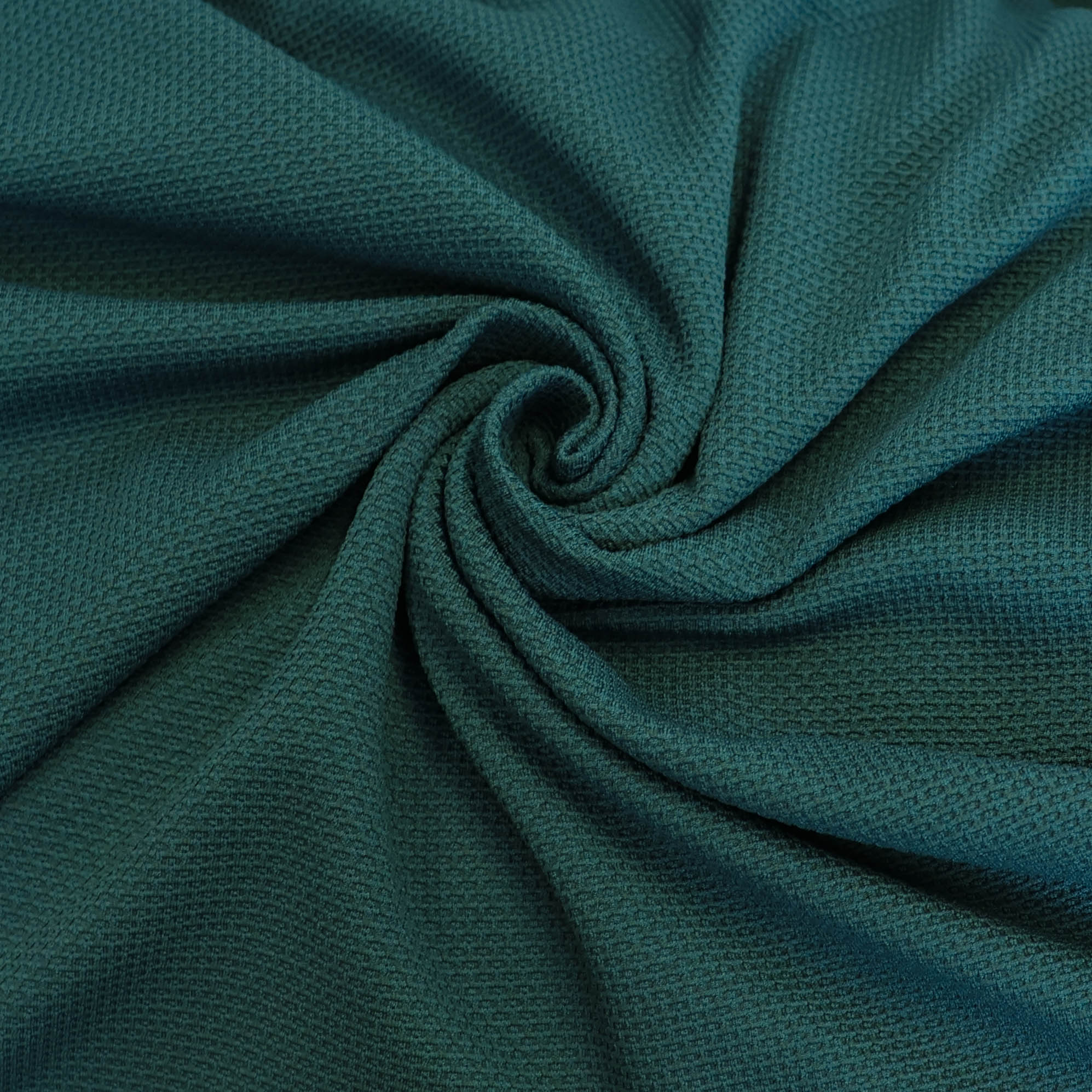 Stretch structuur tricot petrol