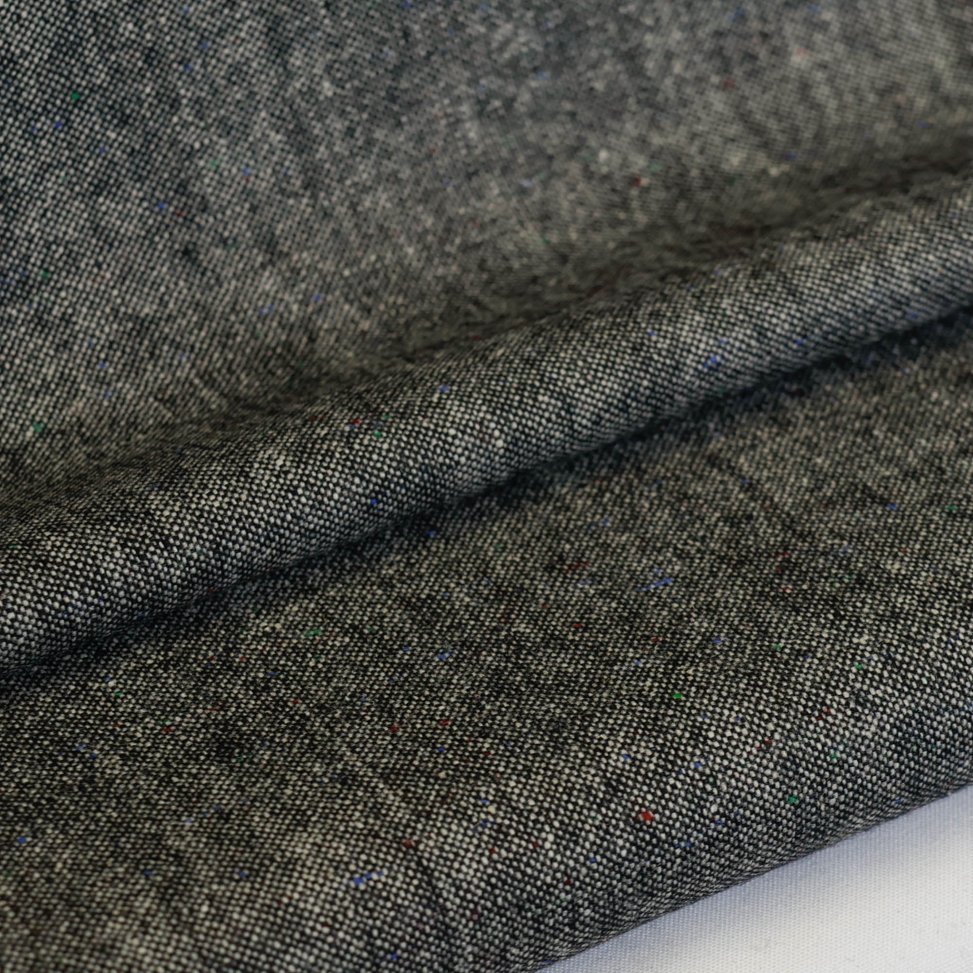 Tweed grijs met kleine gekleurde stipjes