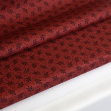 Katoen rood met kleine zwarte bloemetjes