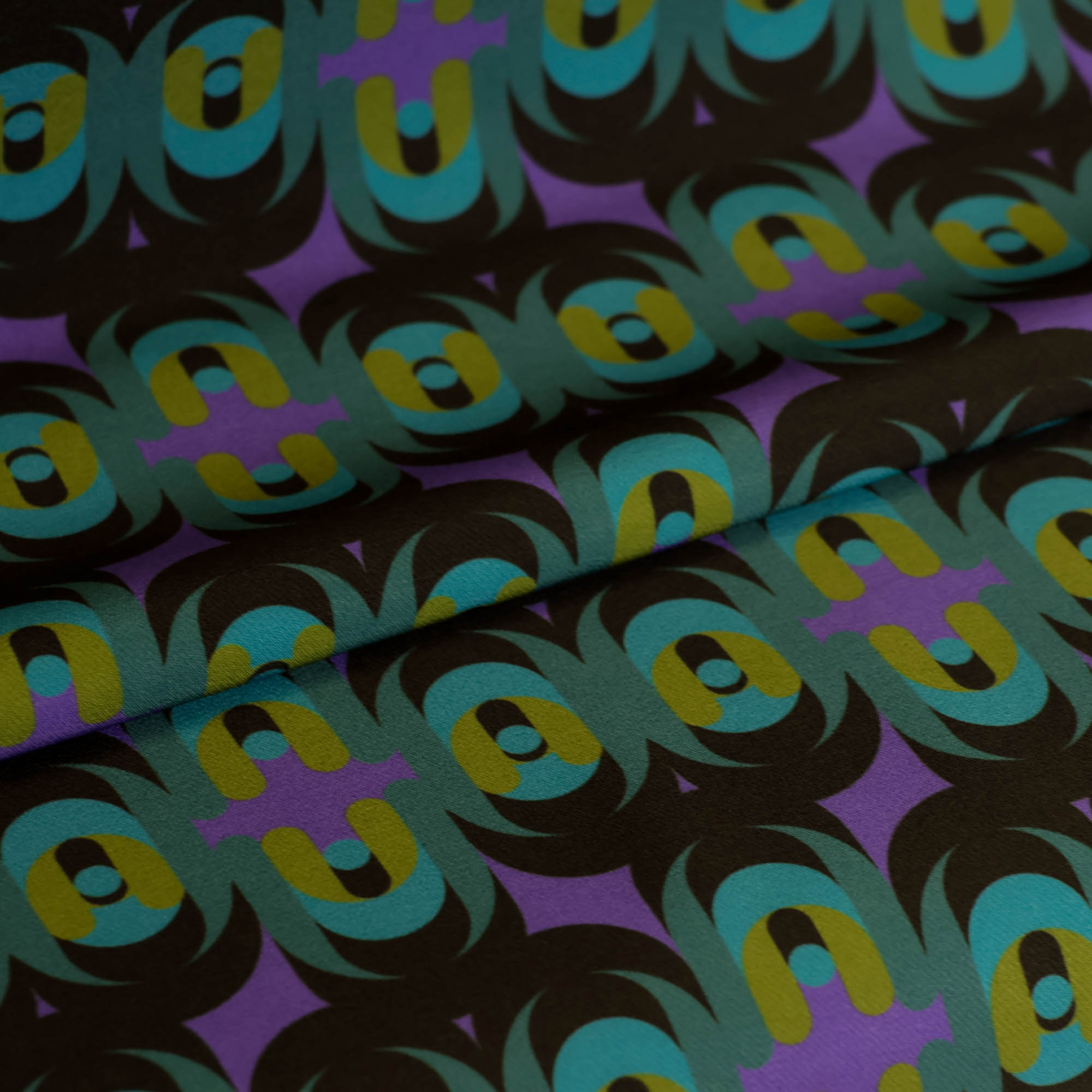 Zware polyester stretch groen-paars abstract patroon  - knipmode