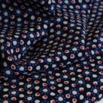 Polyester crêpe blauw met stippen