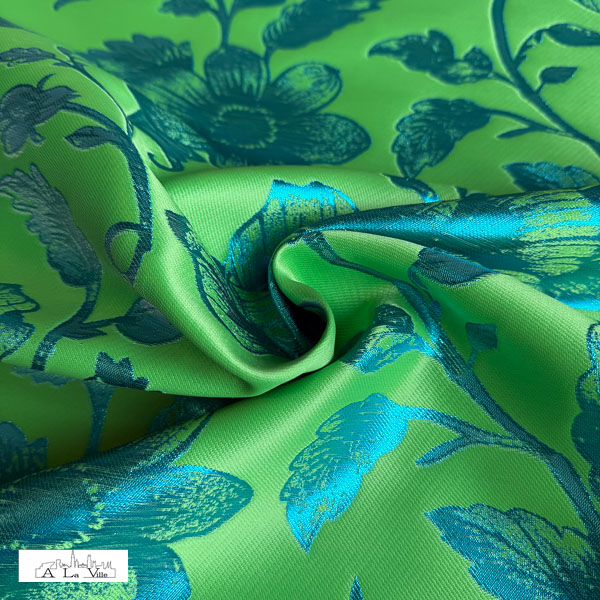 Polyester twill groen met glanzende blauwe bloemen
