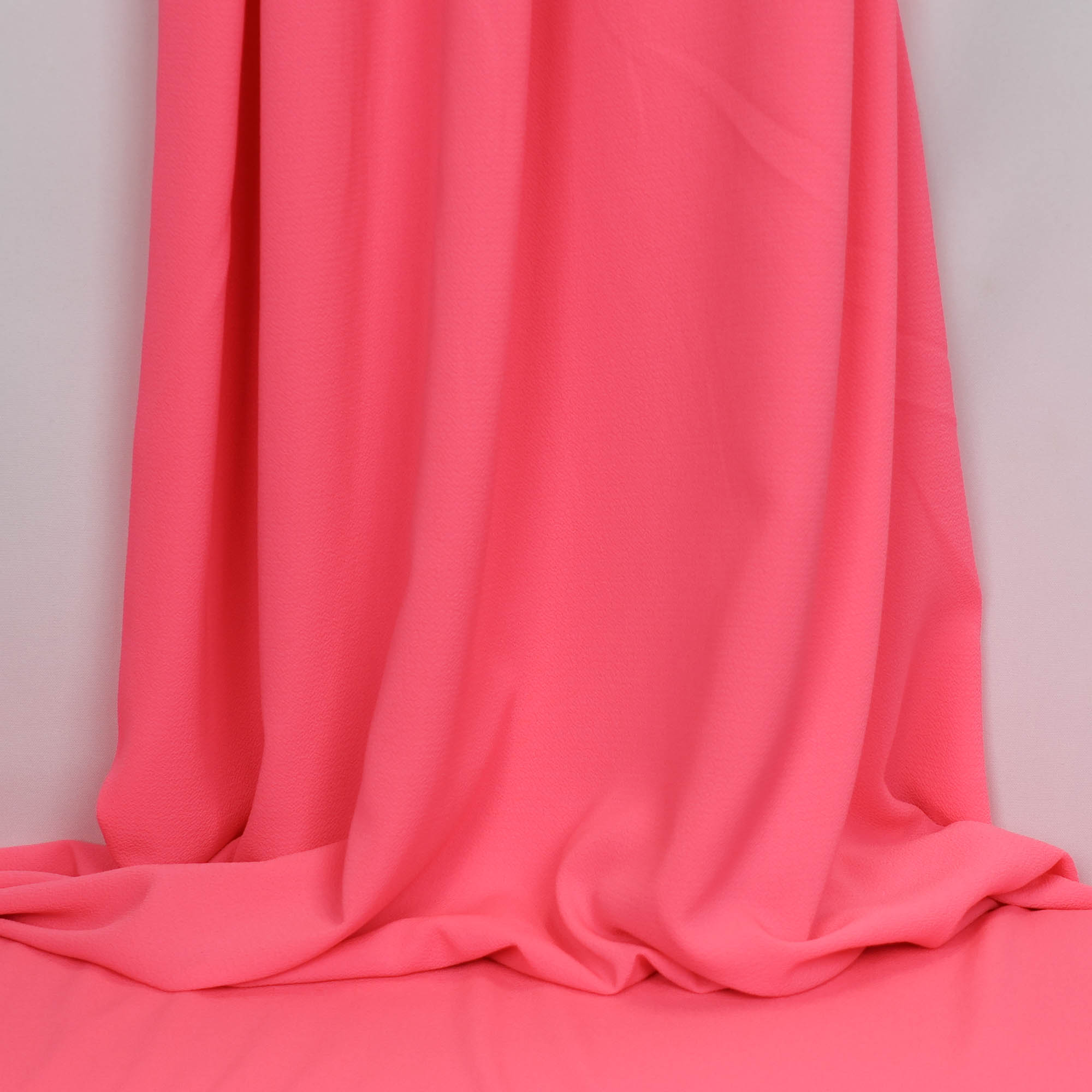Polyester bubble crêpe fluo roze