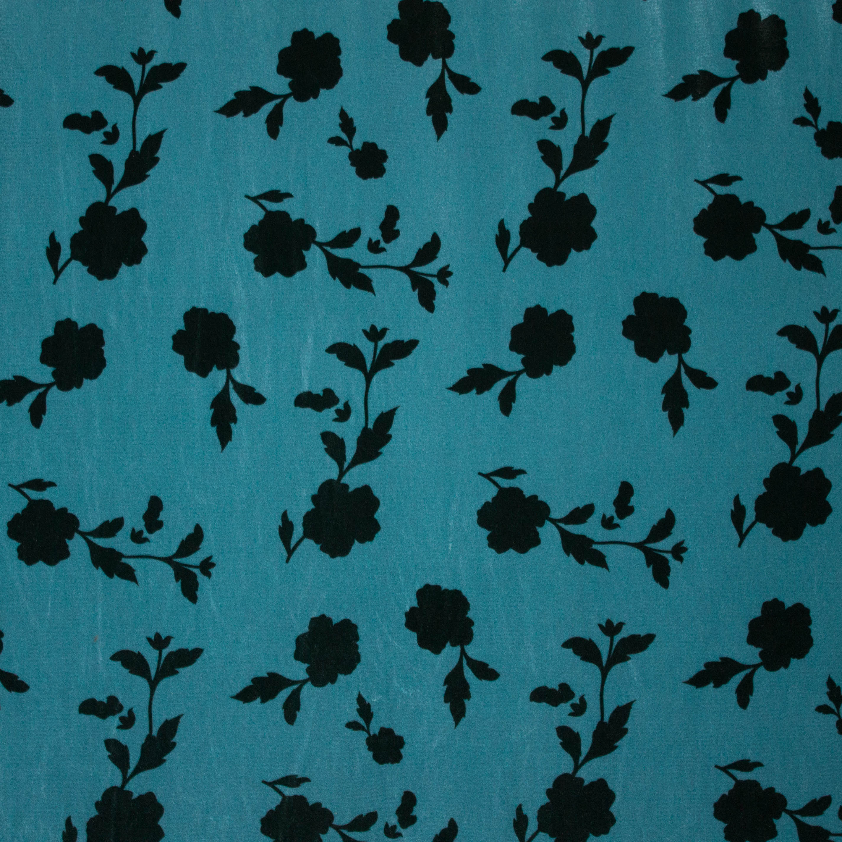Stretch velours/fluweel in blauw met bladmotief