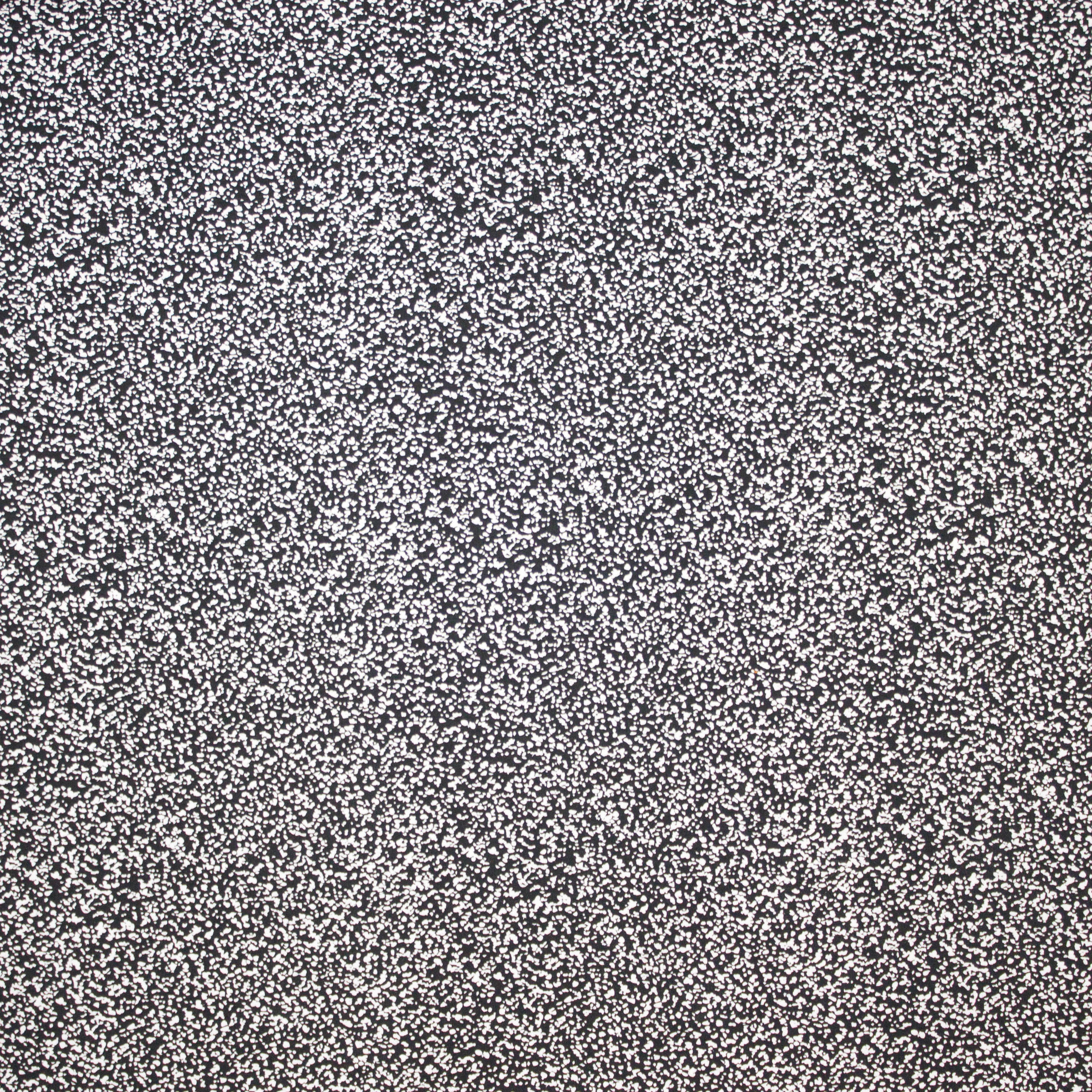 Tricot met zwart - witte vlekjes