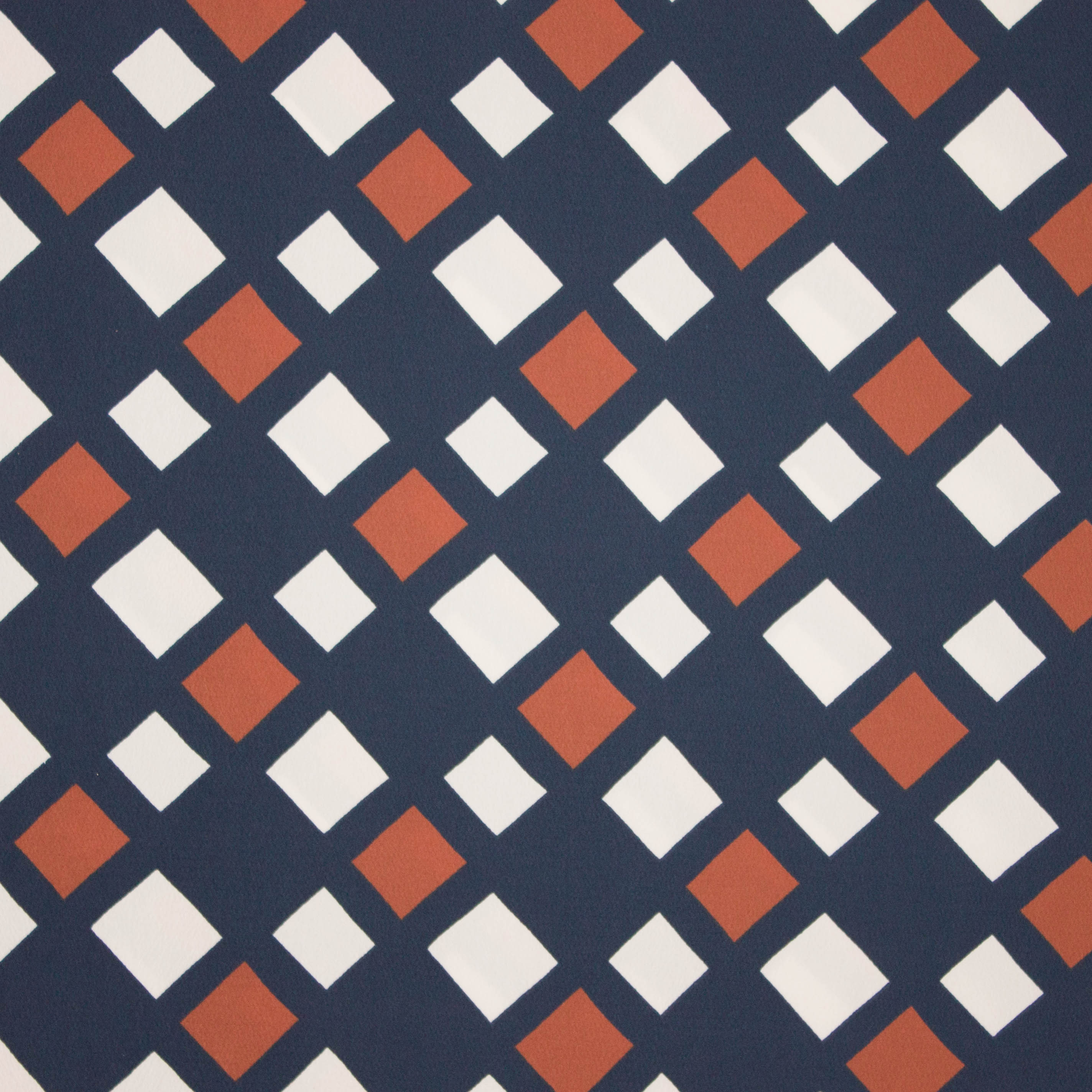 Polyester crêpe blauw met vierkantjes motief