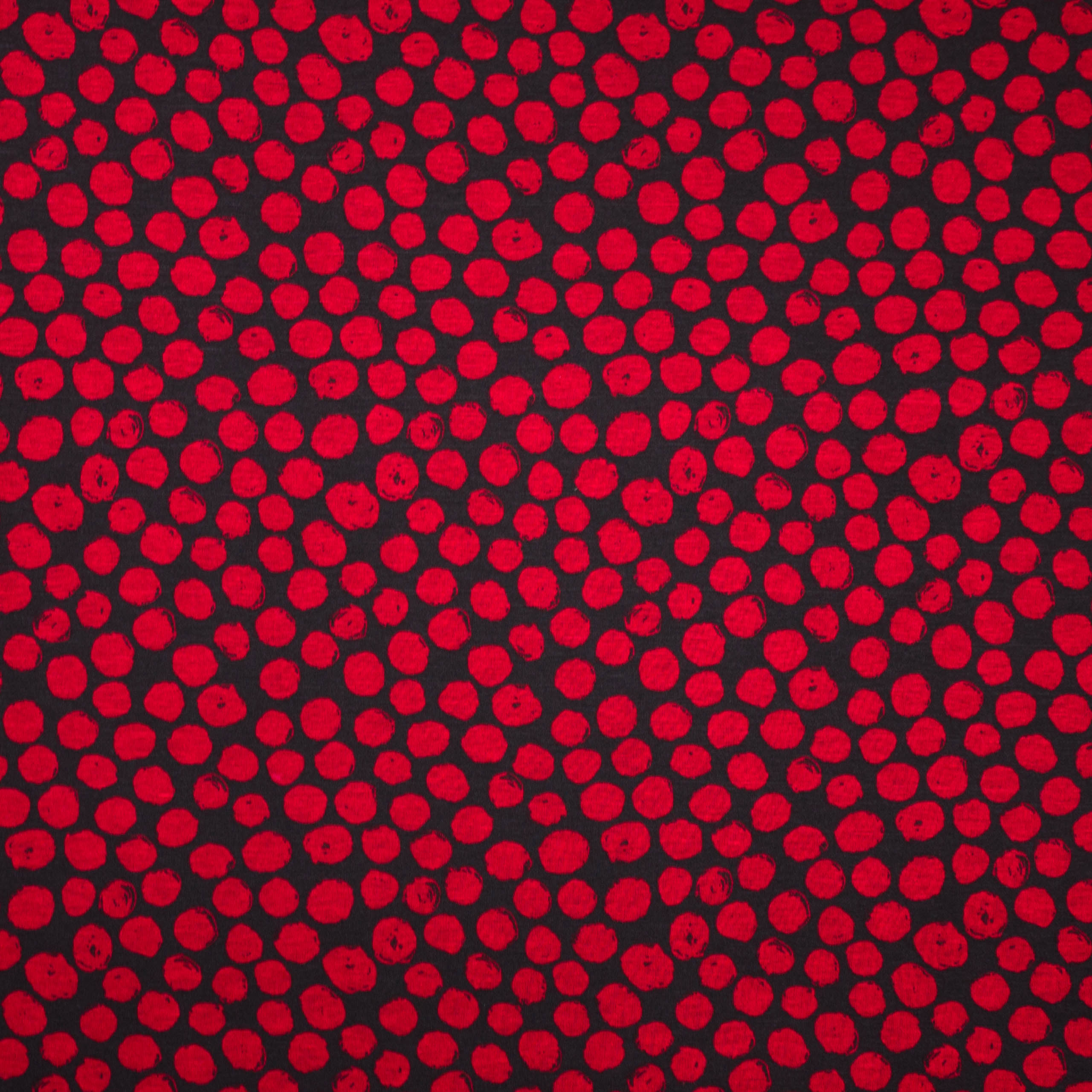 Zwarte polyester / viscose tricot met rode bollen van 'Stitched By You'